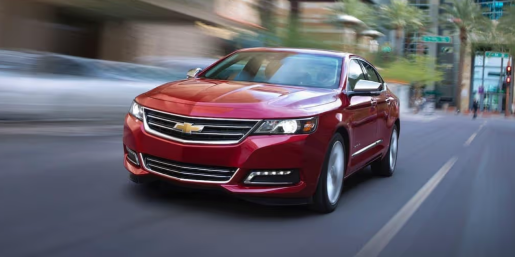 Passenger angle of a red 2020 Chevrolet Impala